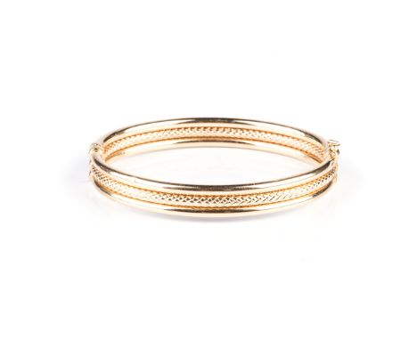 the hinged, hollow tube bangle of typical form 