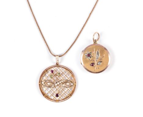  the 9k yellow gold, ruby and diamond locket; and a round pendant with crisscrosses, adorned with ruby, peridot and seed pear