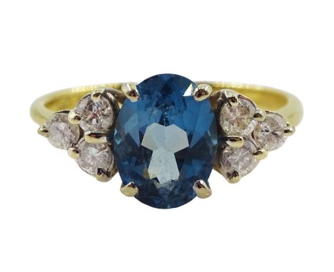 18ct gold oval blue topaz and six stone diamond ring, hallmarked