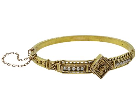 Victorian gold Etruscan Revival hinged bangle set with split pearls, stamped 15ct