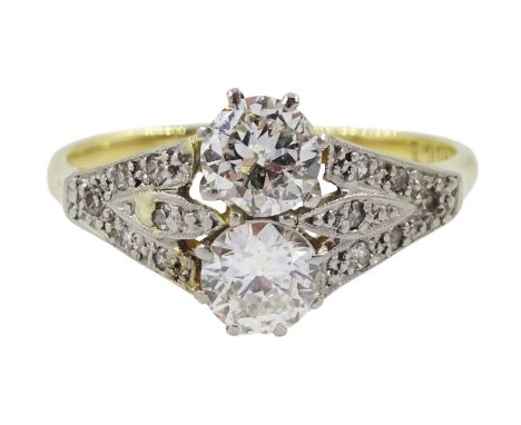 Early-mid 20th century two stone diamond ring, with diamond set shoulders, stamped 18ct, two principle diamonds approx 0.65 c