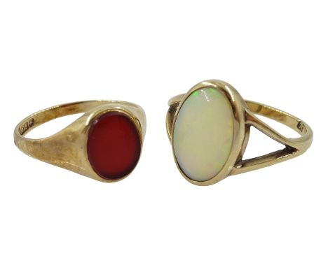 Gold single stone opal ring and a gold single stone carnelian ring, both hallmarked 9ct