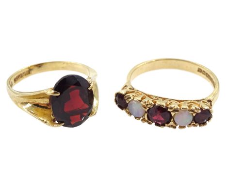 Gold opal and garnet ring ring and a gold single garnet ring, both hallmarked 9ct