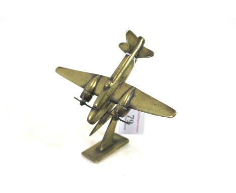 A small cast brass model of a Beau fighter, a good example on a "Lightning" stand 
