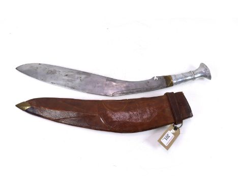 A large Kukri with white metal grip, blade approx. 19" long, tooled leather covered as found scabbard (NB split along inner s