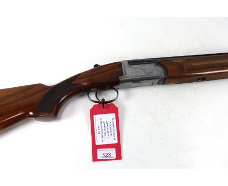 An Italian O/U shotgun with 27&frac12; barrels, having clean bores. This is a single trigger model in overall fair/good condi