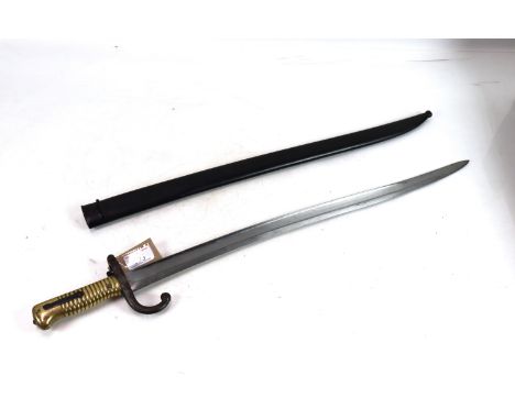 A French model 1866 brass hilted bayonet dated 1869 with scabbard