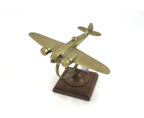 A brass Blenheim MkIV model on sprung support and wooden plinth 