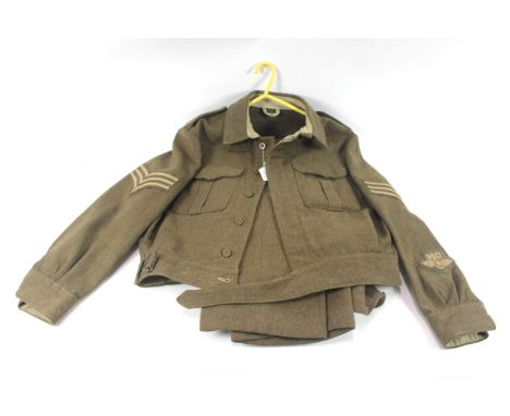 A battle dress blouse and trousers, jacket having insignia including despatch rider badge and Sgt, stripes etc.