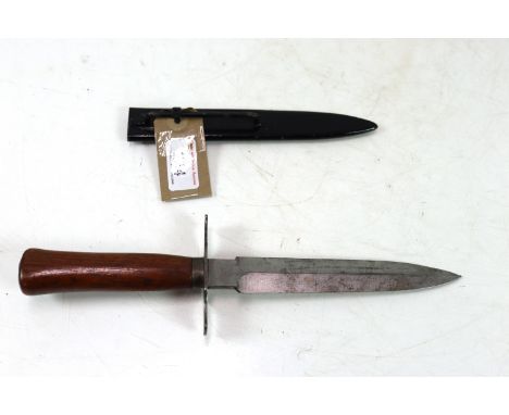 A French WWI era fighting knife with correct scabbard. Blade marked "41 Gonon", in overall very good condition