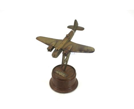 A Bristol Blenheim MkIV brass model on "Lightning" stand and wooden plinth with plaque 