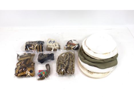 A collection of Royal Navy related items including cap covers x 7, various insignia, lanyards and epaulettes etc.