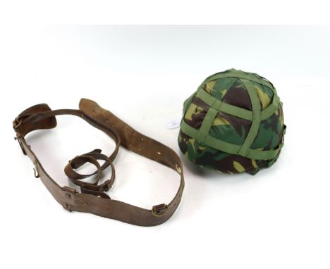 A British Kevlar helmet (dated 1984) with a vintage Sam Browne belt and cross strap
