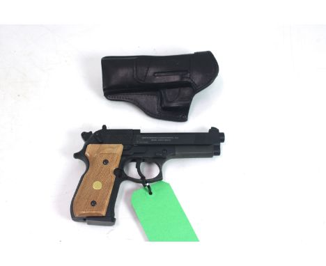 An Umarex Beretta 92 FS .177 Cal. Co2 air pistol, Ser. No. HG21105898. This example with matt black finish and wooden grips, 
