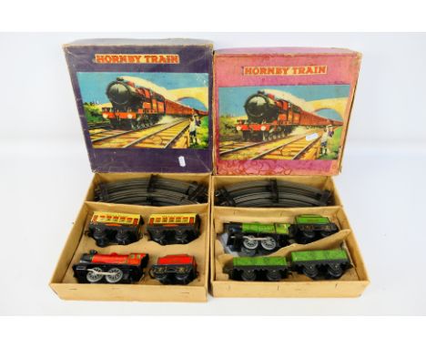 Hornby - Two boxed O gauge clockwork trains sets from Hornby, including Hornby TS402 MO Passenger Set with TS401 MO Goods Set