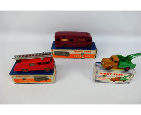 Dinky Toys - Three original Dinky vehicles to include 581 Horse Box, 555 Fire engine and 430 Breakdown Lorry. Items all show 
