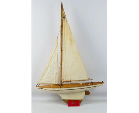Star Yachts - A vintage wooden Super Bermuda series Star pond yacht named Arctic Star in white with gold trim # SB3. The mode
