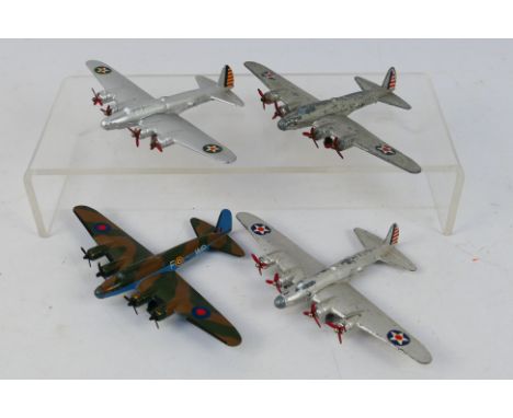 Dinky Toys - An unboxed group of four pre-war Dinky Toys 62g Long Range Bomber - three of the models are in original silver, 