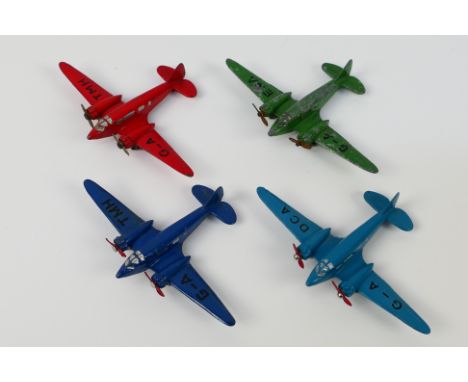Dinky Toys - Four unboxed Dinky Toys model aircraft. Lot includes 62m Light Transport Plane(x2) one in red and one blue with 