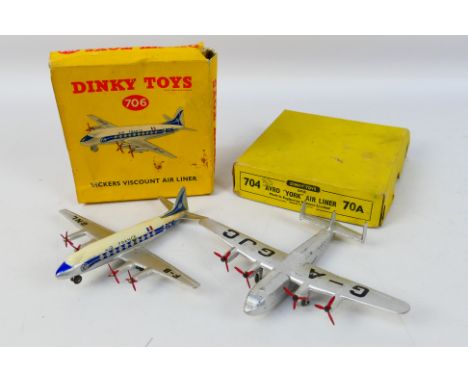 Dinky Toys - Two boxed Dinky Toy model aircraft. Lot consists of Dinky Toys #704 Avro York Airliner 'G-AGJC' in silver; with 