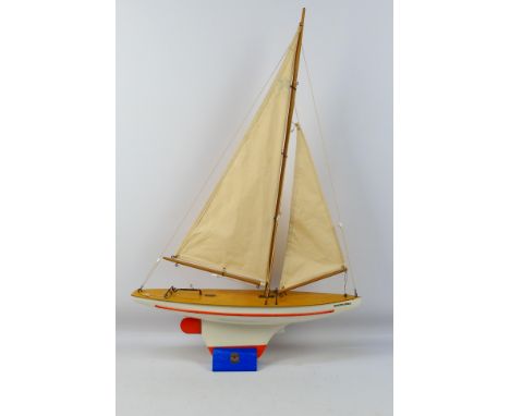 Star Yachts - A vintage wooden Super Bermuda series Star pond yacht named Pacific Star in white with orange trim # SB2. The m