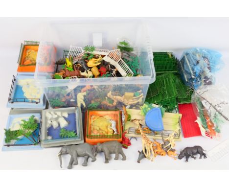 Britains - A large amount of unboxed predominately Britains zoo animals and zoo accessories. Lot includes elephants; rhinocer