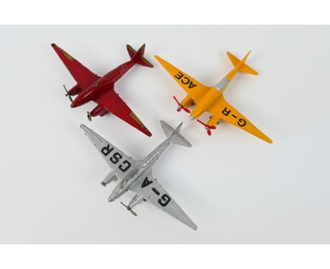 Dinky Toys - Three unboxed Dinky Toys model aircraft. Lot includes 62g De Havilland Comet (x2) one in red no markings with go