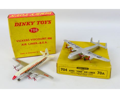 Dinky Toys - Two boxed Dinky Toy model aircraft. Lot consists of Dinky Toys #704 Avro York Airliner 'G-AGJC' in silver; with 