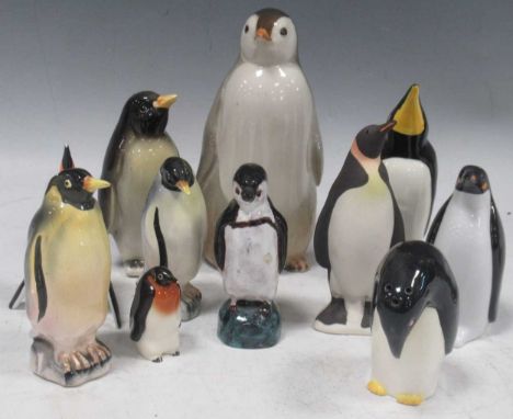 Ceramic collection of amusing penguins in various attitudes (11)