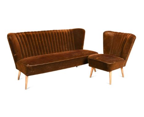 A Mid-century Hungarian three-piece suite, circa 1970,  the scallop back three-seat sofa and pair of chairs upholstered in br