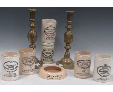 'Queen of Diamonds' - a pair of Victorian brass candlesticks together with a Cauldon potteries ashtray for Guinness, circa 19