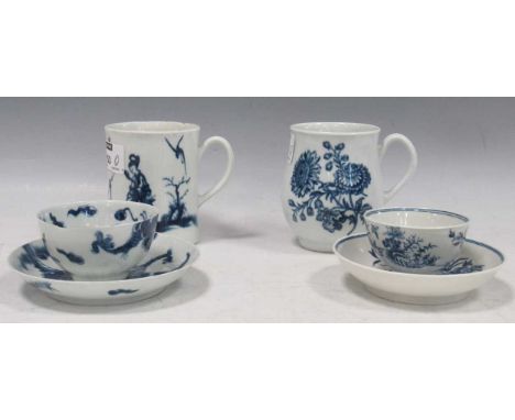 A group of Worcester blue and white porcelain, 18th century, comprising a bell-shaped mug decorated with floral sprays, a mug