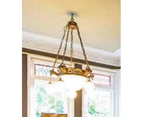 A late 19th/ early 20th century gilt metal circular ceiling light, with central opaline glass bowl, surrounded by five cast a