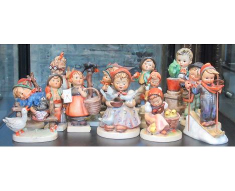 A collection of 17 Hummel china figurines