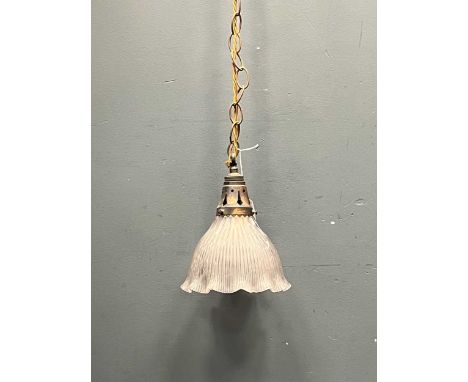 A late 19th century brass and glass pendant ceiling light, the moulded glass shade ribbed with flared rim, 24cm high and 18cm