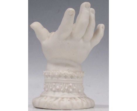 A Worcester Parian model of a hand, the lace and ribboned cuff decorated with tiny beads, 10cm high