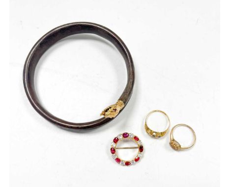 A white sapphire and synthetic ruby circular brooch tested as 18ct gold, a ring stamped '18CT', and a hallmarked 18ct gold ri