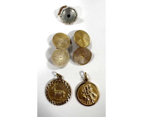 A pair of cufflinks marked '9ct' and two 9ct zodiac/St Christopher medallions, 12.7g gross, and a mother of pearl inset dress