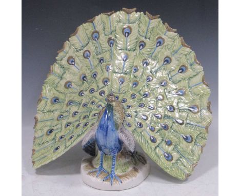 A large ceramic peacock, continental. 37cms High 