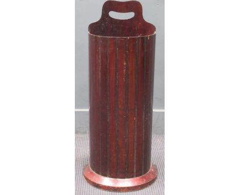 A mahogany bow fronted stick stand, early 20th century,the raised back with pierced carrying handle79 x 29 x 18cm