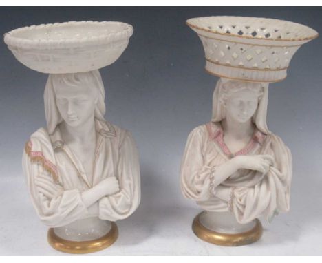 A pair of Parian table centrepieces, probably Worcester, modelled as classical female busts supporting baskets balanced on th