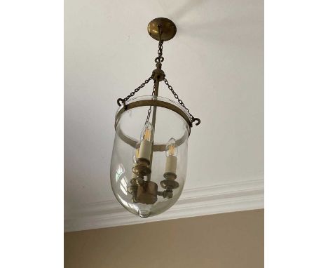 A three lamp brass ceiling light with clear glass bowl shade, 22cm wide and a rococo style gilt finish single lamp ceiling ch