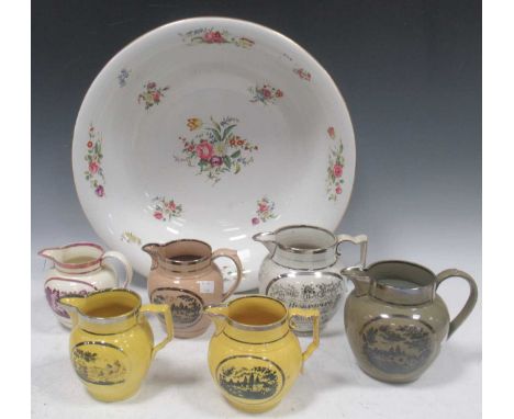 An attractive collection of 19th century lustreware jugs, decorated with transfer printed pastoral scenes, largest measures 1
