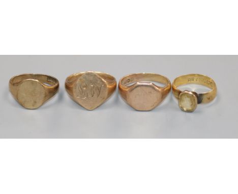 Three 9ct gold signet rings and an 18ct gold and gem set ring.