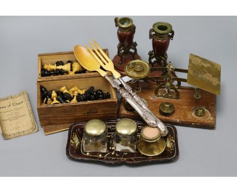 A bookslide, chess pieces, scales, silver handled servers etc