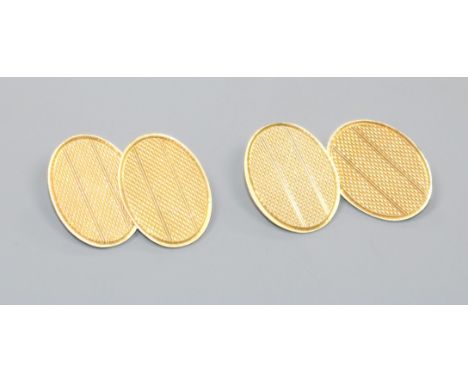 A pair of engine turned 18ct gold cufflinks.