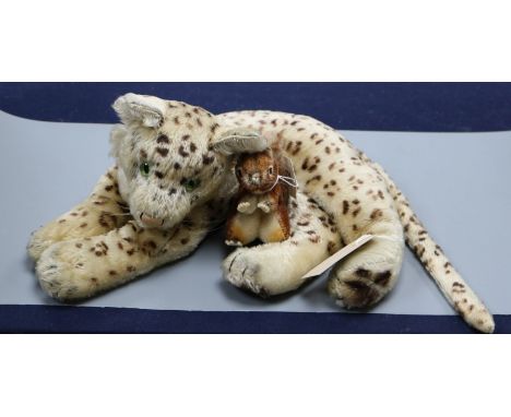 A Steiff reclining leopard with green glass eyes, circa 1940's and a small squirrel (lacking buttons)