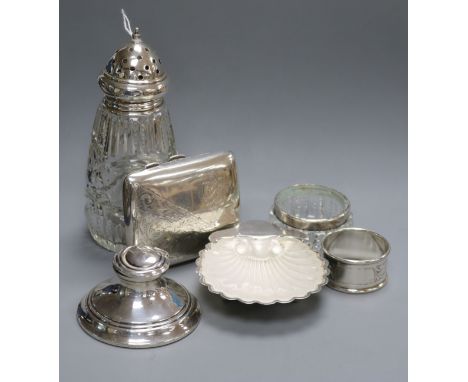 A 1930's silver butter shell with glass liner, a silver cigarette case, inkwell, etc.