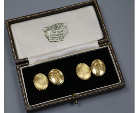 A pair of 18ct gold oval cufflinks.