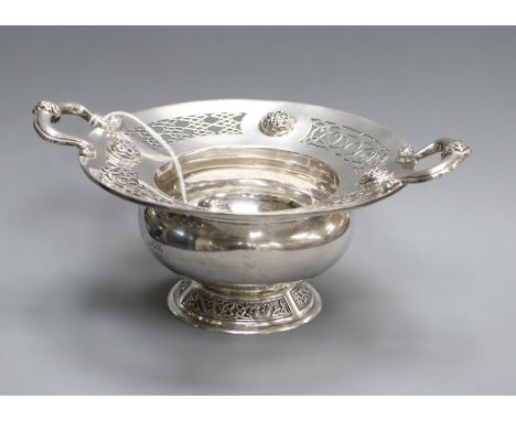 An Edwardian silver two handled presentation bowl, with Celtic decoration, Wakely &amp; Wheeler, London, 1907, 18.8cm over ha